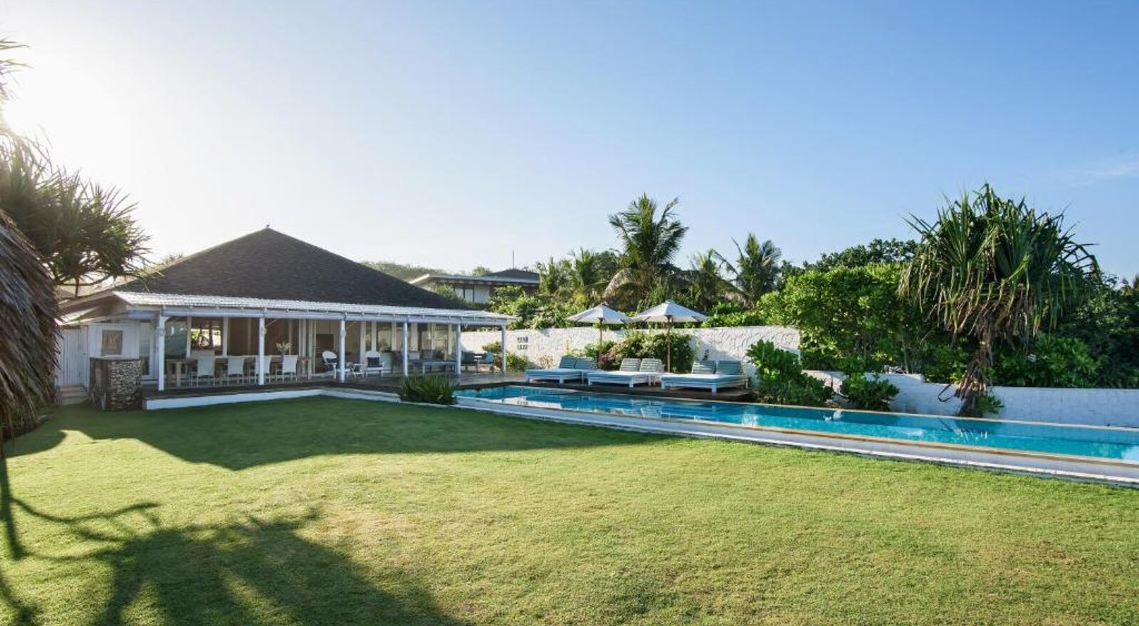The beach house, lawn and pool